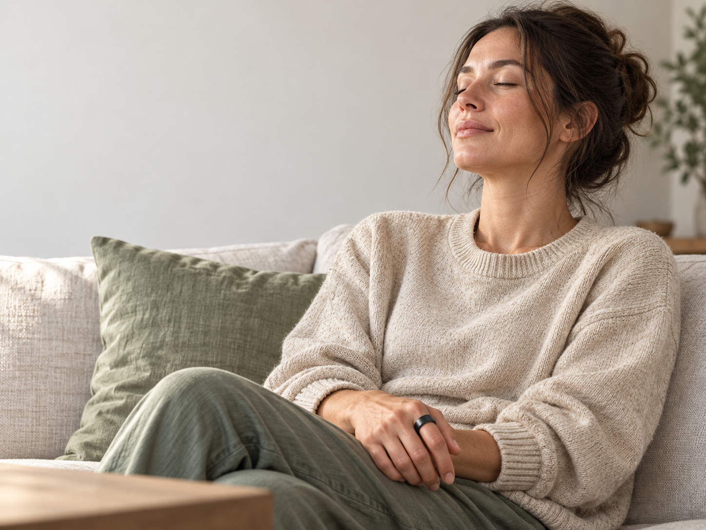 Person taking a calm moment while wearing an OVELOR ring