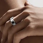 Gen 3 Silver Health Tracking Ring — silver ring worn on a hand resting against a shoulder
