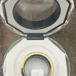Gen 4 — open charging case viewed from above.