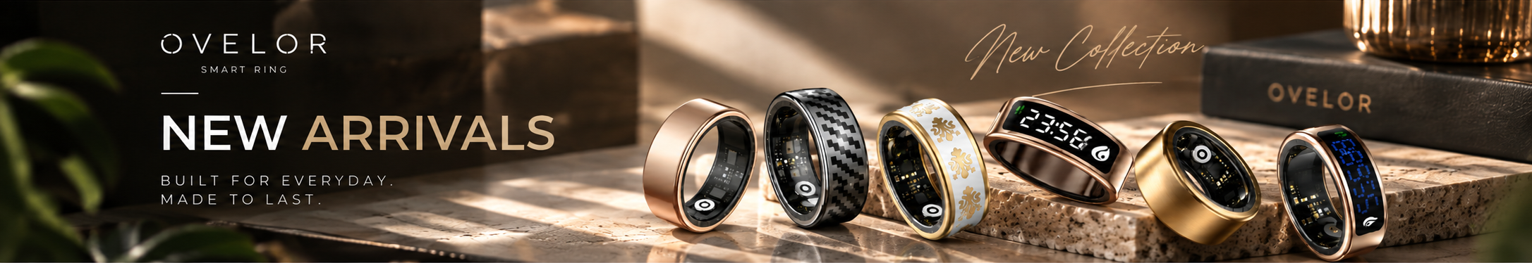 OVELOR New Arrivals smart ring collection on warm stone platforms, without exterior white margins.